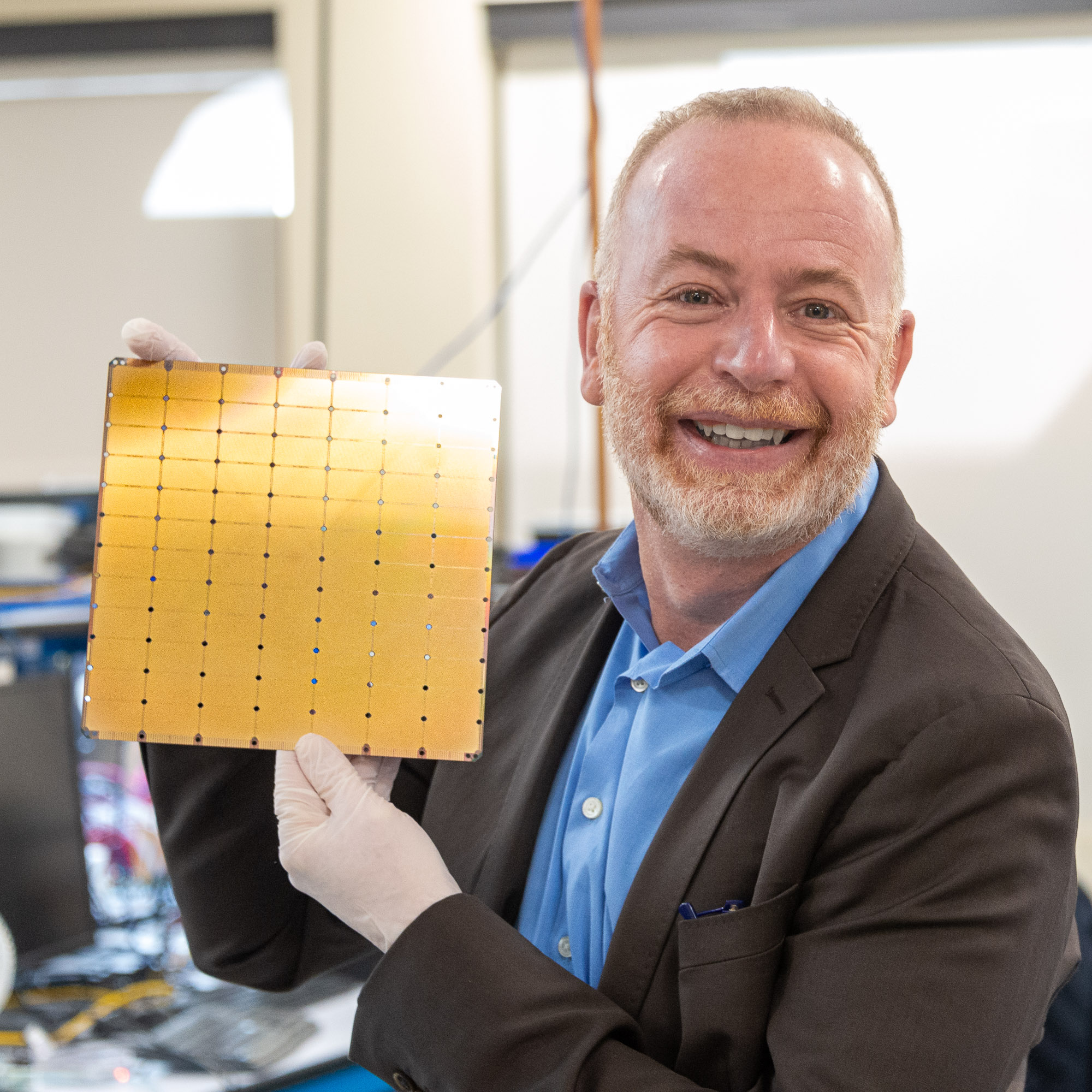 Person with very large silicon chip